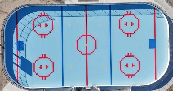 Aerial view of the outdoor box at Sprowls Horizon Sports Park, with a light blue surface and boards